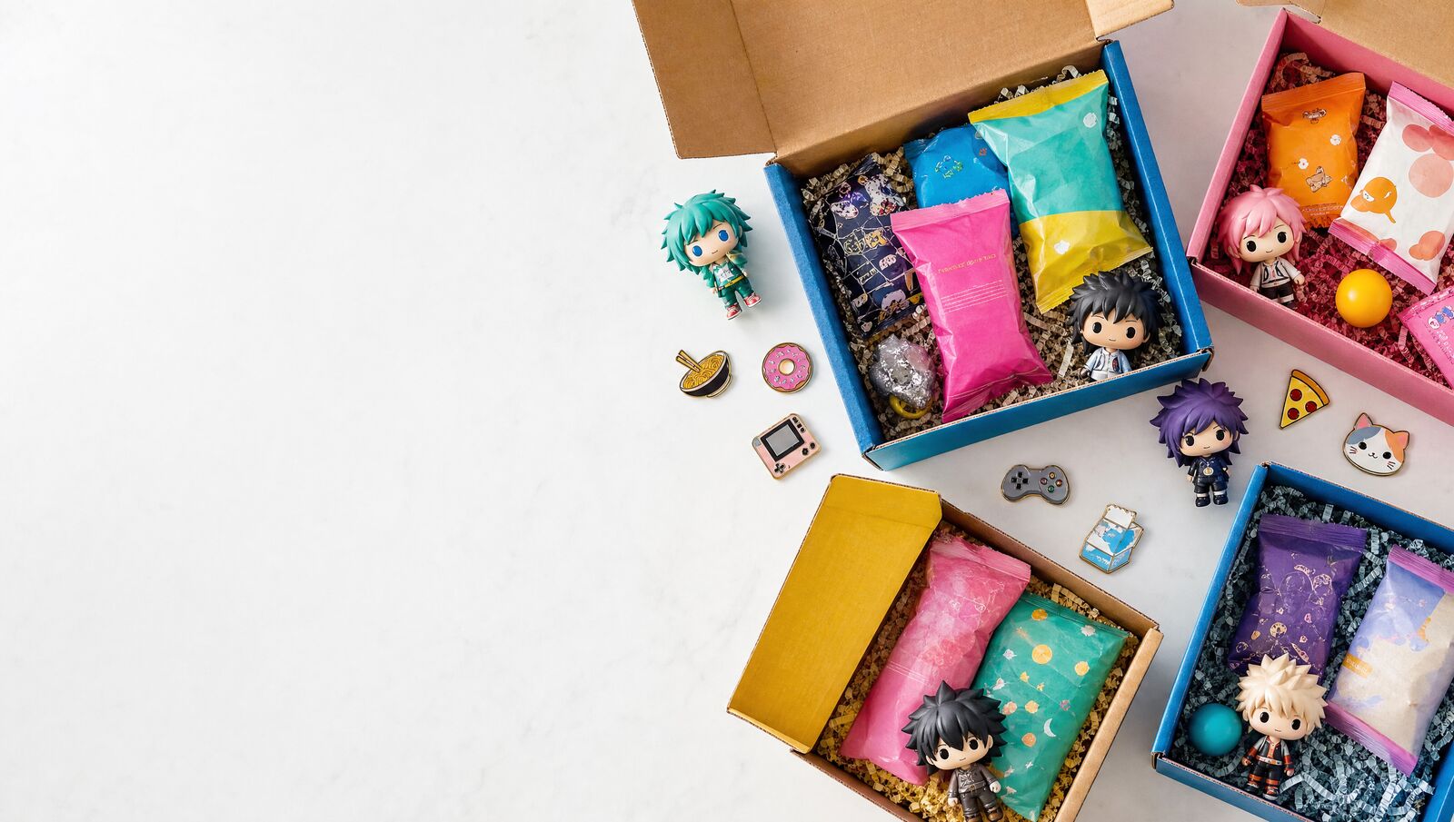 Open subscription boxes with snacks and collectibles on a bright table